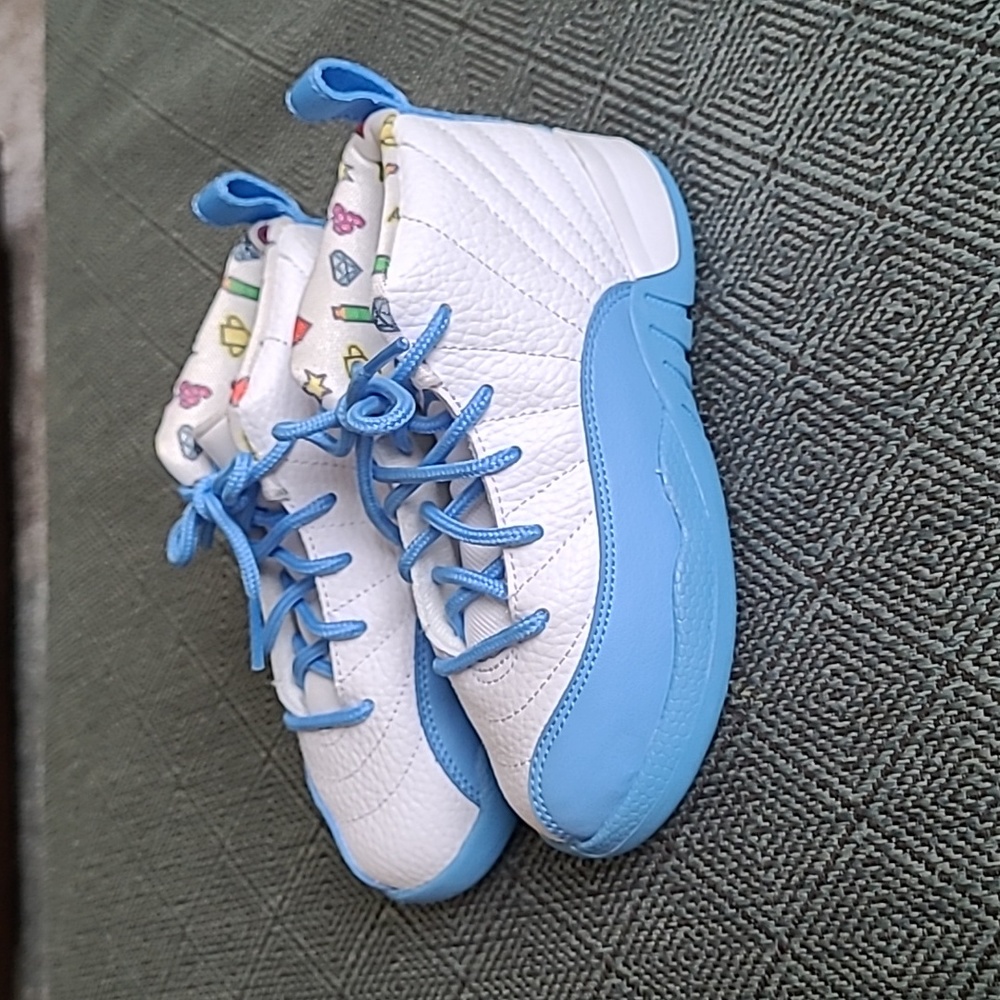 Girls size 10 Air Jordan 23 high top tennis shoes.